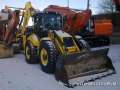 - New Holland LB115B, . .